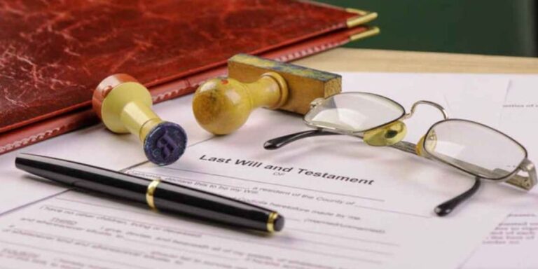 Probate attorney organizing estate documents including will, death certificate, and financial records | What Documents Do You Need to Start Probate