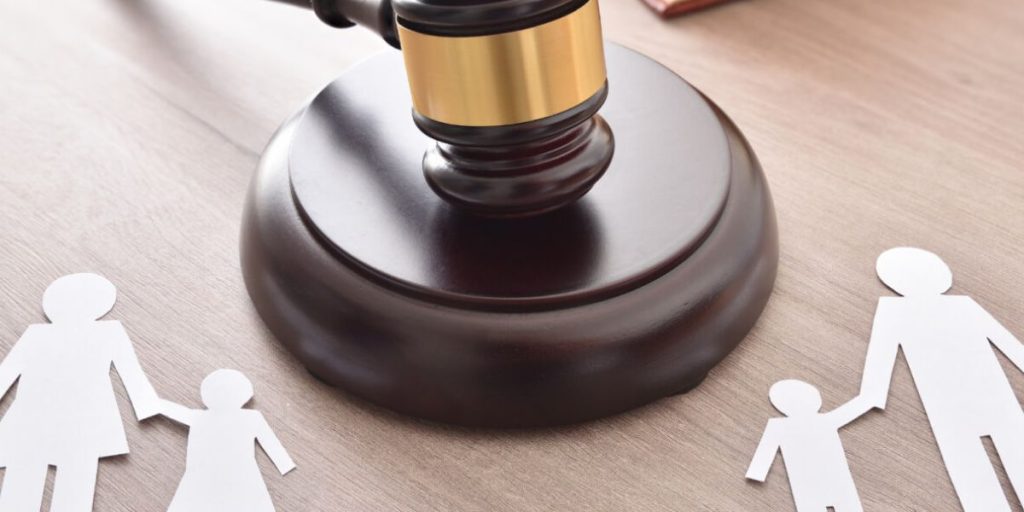 Parents meeting with a family law attorney to discuss legal and physical child custody arrangements | Difference Between Legal and Physical Custody